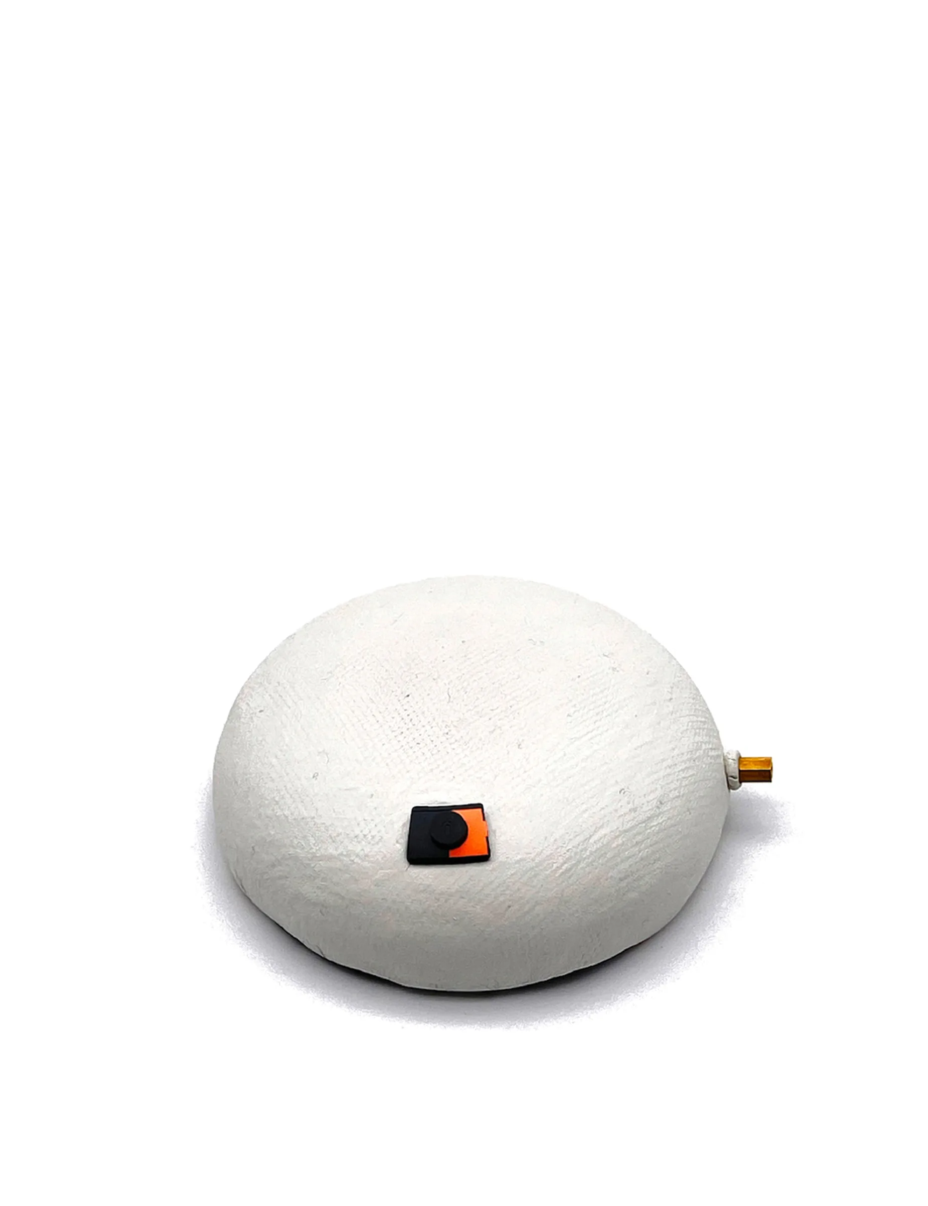 Item for the Great Reset: Virtual Reality to Physical Reality Transmitter, conceptual sculpture by Barbara K. Prokop using a speaker cover, electrical components and air drying clay