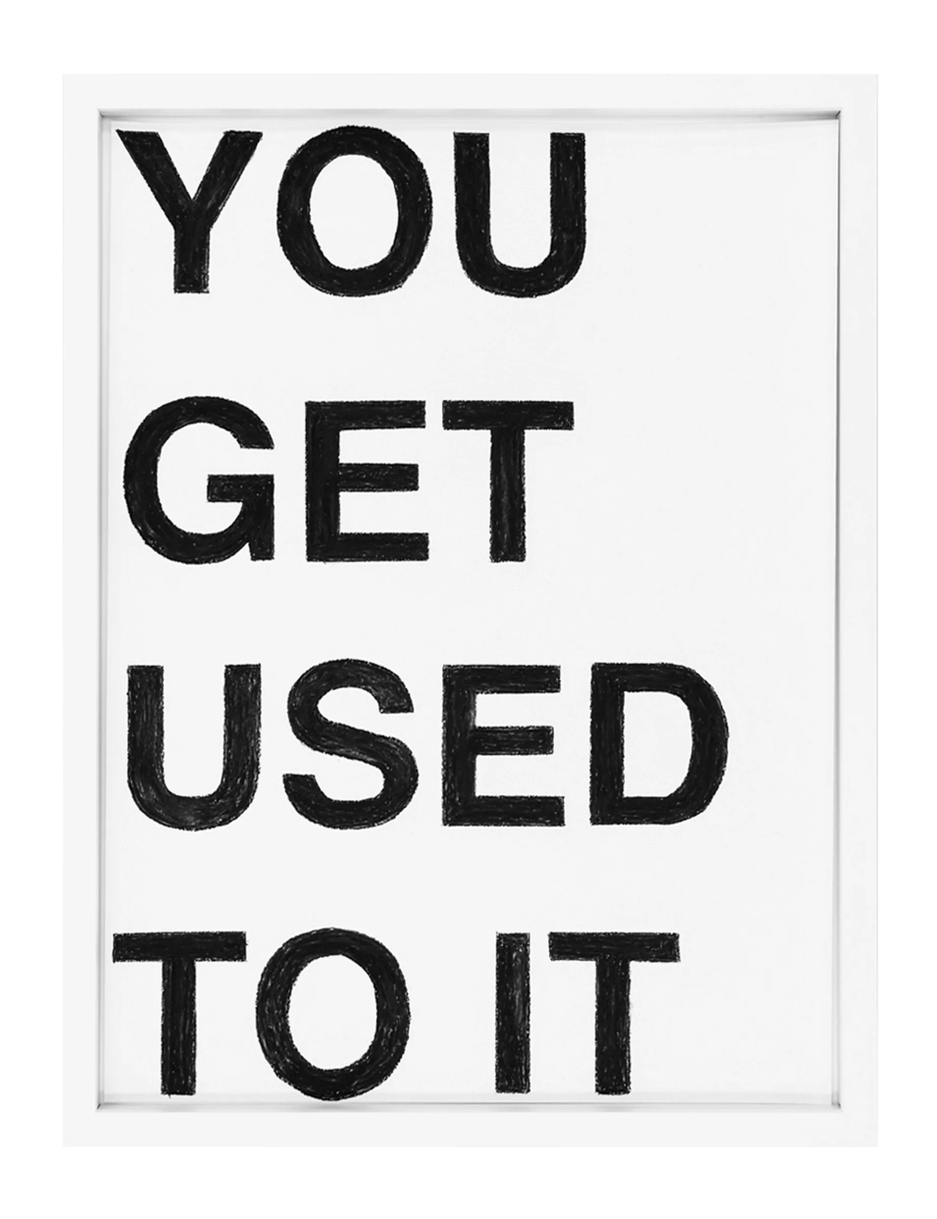 Framed pastel on paper showing stacked black capital letters reading 'YOU GET USED TO IT'; the artwork YOU GET USED TO IT by Barbara K. Prokop displays visible pastel strokes and slight smudging.