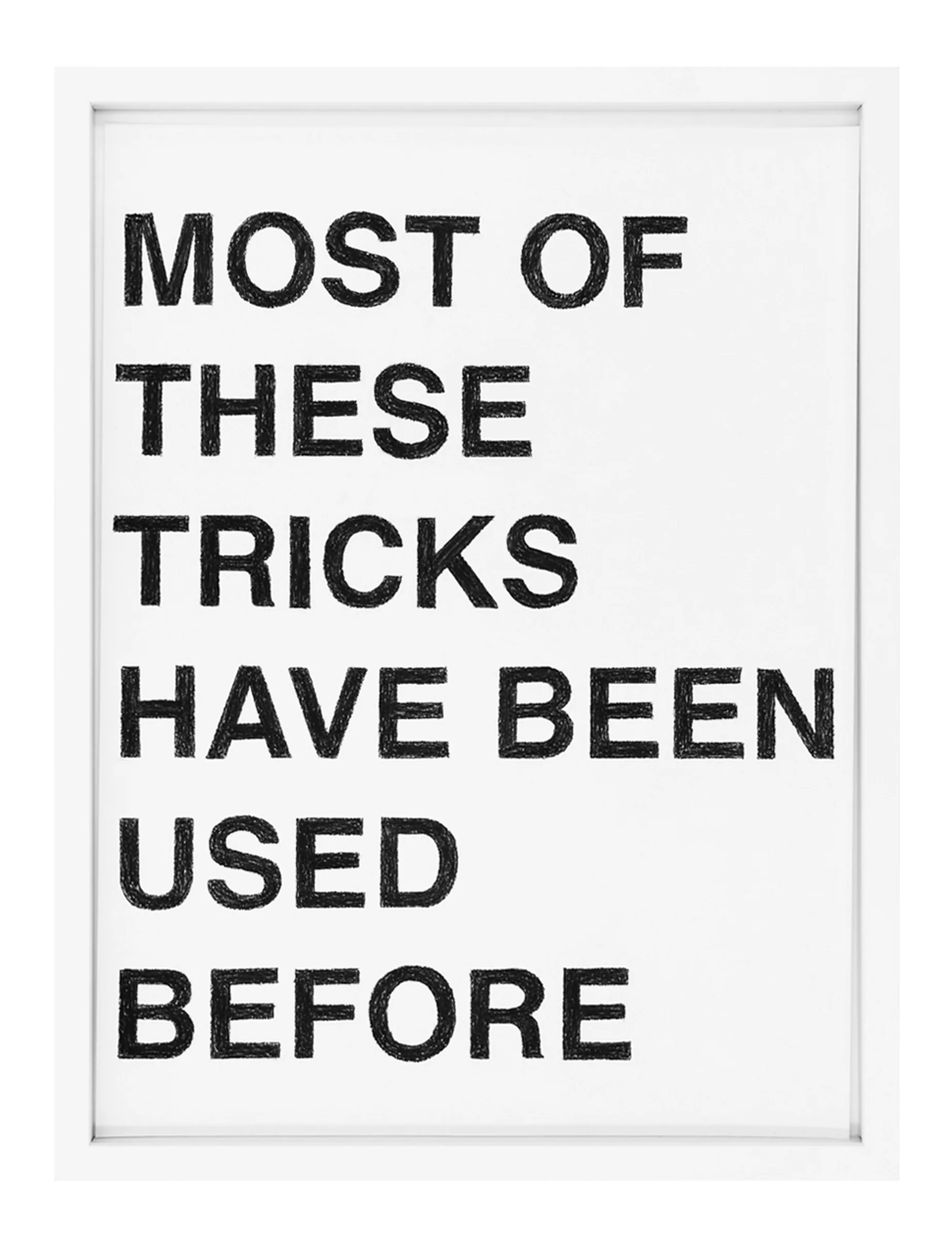 Framed white sheet with textured black pastel block letters reading 'MOST OF THESE TRICKS HAVE BEEN USED BEFORE' visible across the page — artwork by Barbara K. Prokop.